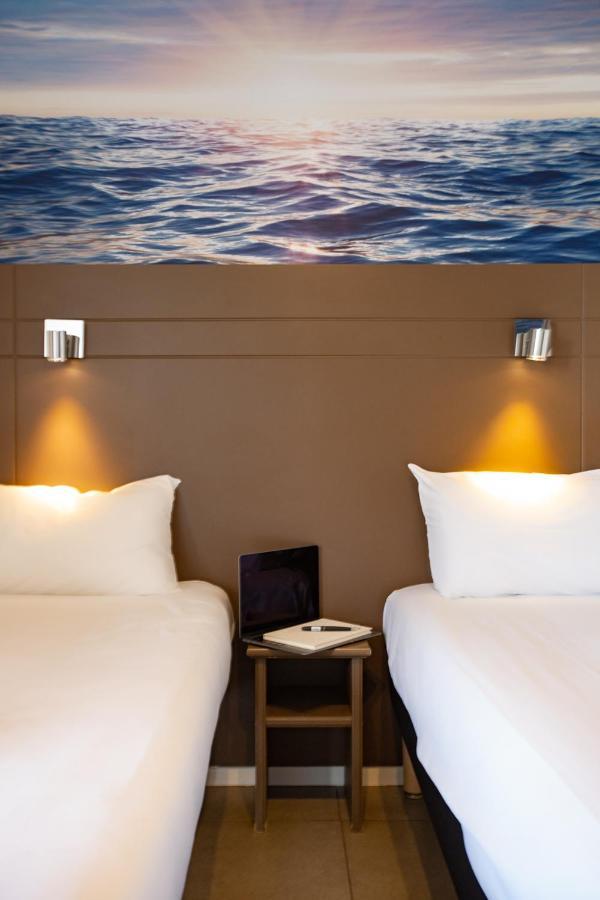 Hotel Confort Le Moulin Rouge Terrasson Bagian luar foto